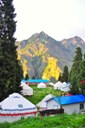 Yurt and mountain about sunset.